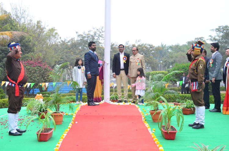 Mr. Umesh Trivedi, along with other dignitaries paying respect to the nation post unfurling the flag in presence of other respected dignitaries.